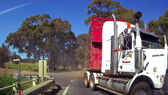 Footage has emerged of a terrifying close call between a truck carrying live sheep and a car on Main South Road. Picture: Supplied