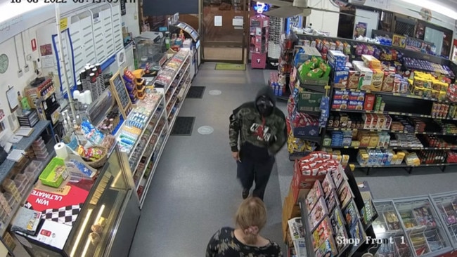 CCTV of a man wielding a syringe to threaten a female staffer at Heatley Fare Convenience Store on Tuesday night.