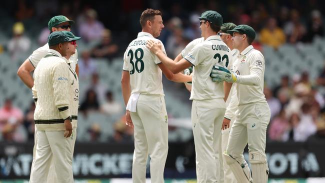 Josh Hazlewood and Pat Cummins Australia celebrate the wicket of Alick Athanaze. Picture: Paul Kane/Getty Images