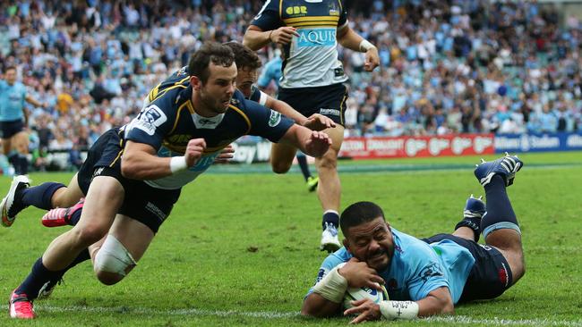 Waratahs hooker Tolu Latu scores a try against the Brumbies.