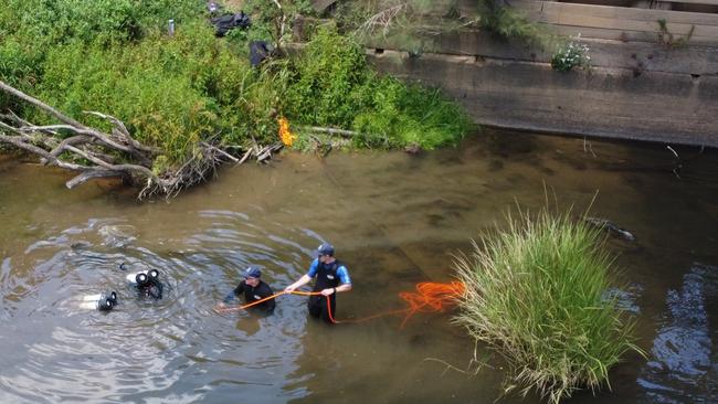 Police divers search Hastings River near Kindee Bridge.