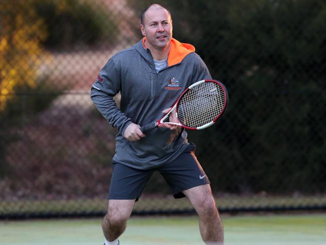 Former semi-pro Tennis Player Treasurer Josh Frydenberg,  playing tennis at the courts at Parliament House in Canberra. Picture Kym Smith