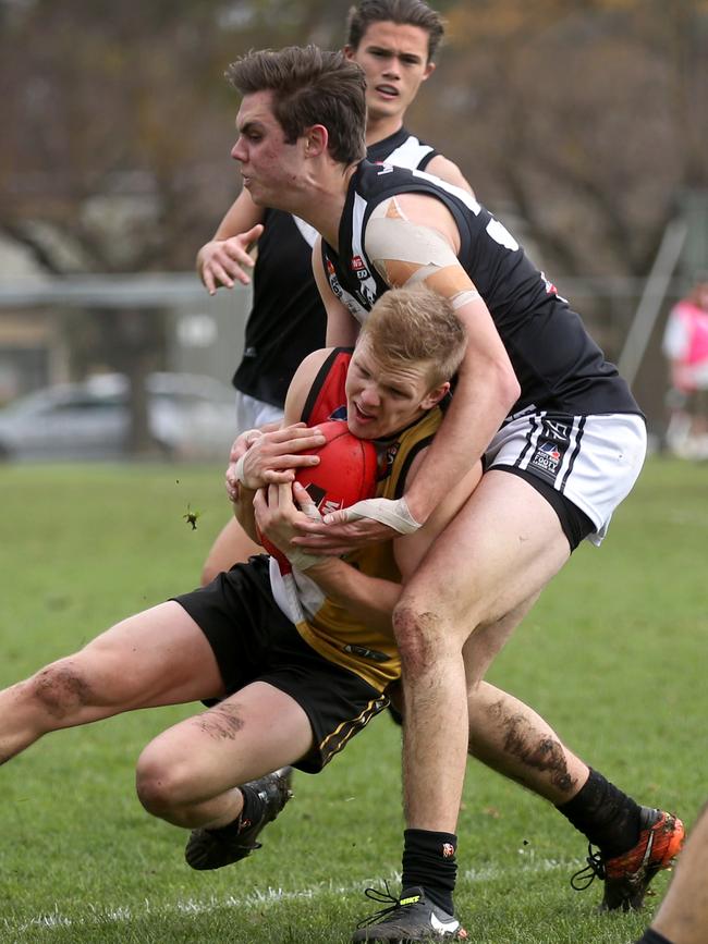 Blacks defender Charlie Parker lays a tackle. He has ventured out to Sturt this season. Picture: AAP/Dean Martin