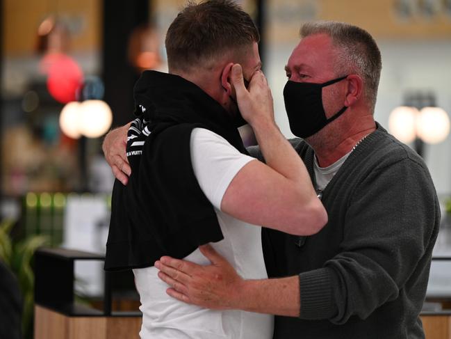 Chris Leech, who lives in Melbourne, reunites with his dad Steven as the borders opened on Tuesday. Picture: Naomi Jellicoe