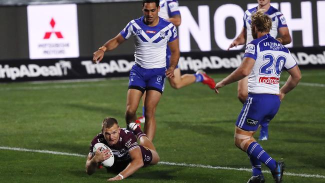 Manly’s Tom Trbojevic dives over to score against the Bulldogs in a comfortable win for the Sea Eagles at Central Coast Stadium on Sunday night. Picture: Getty Images