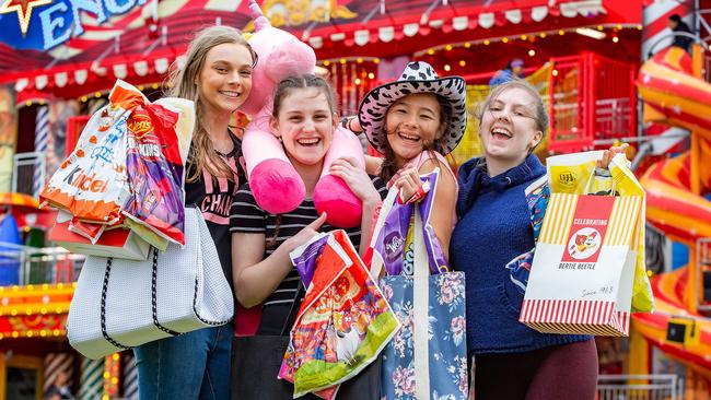 Tara, 17, Sarah, 16, Elentari, 16, and Louise, 17, load up on showbags at the Royal Melbourne Show. Picture: Sarah Matray