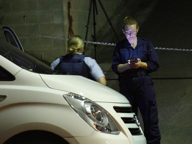 Police at the scene of the fatal stabbing at North Gosford. Picture: Gordon McComiskie