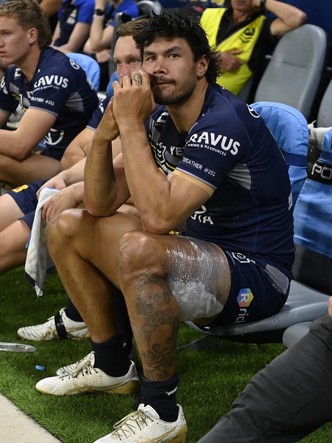 TOWNSVILLE, AUSTRALIA - AUGUST 29: Jordan McLean of the Cowboys sits on the bench with ice strapped to his leg during the round 26 NRL match between North Queensland Cowboys and Melbourne Storm at Qld Country Bank Stadium, on August 29, 2024, in Townsville, Australia. (Photo by Ian Hitchcock/Getty Images)