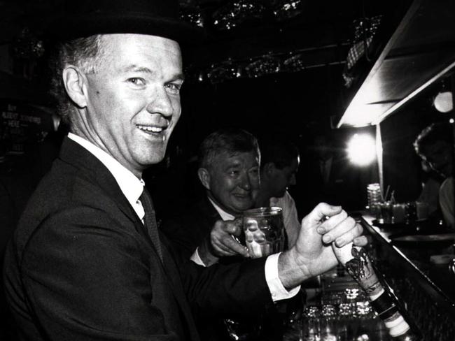 Wayne Goss pulls a beer in 1990. Picture: The Courier-Mail archives