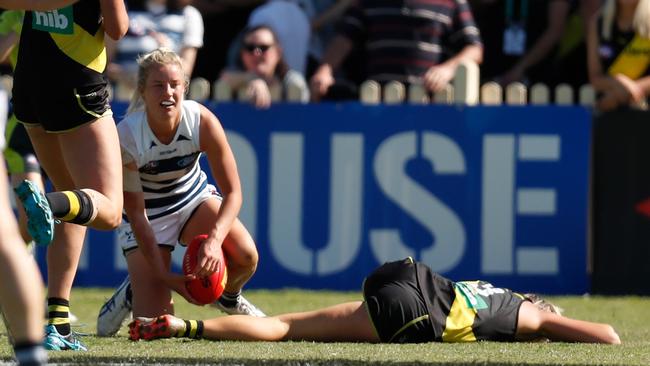 Katie Brennan of the Tigers lays injured after copping a high bump.