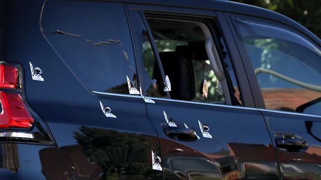 A car that appears to have several bullets holes at the scene in Fairfield. Picture: Damian Shaw