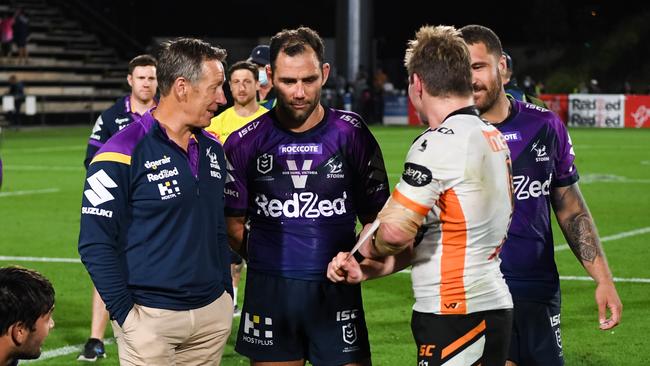 Storm coach Craig Bellamy, and captain Cameron Smith at Sunshine Coast Stadium on Saturday night — both have been targets of the Broncos. Picture: NRL Photos