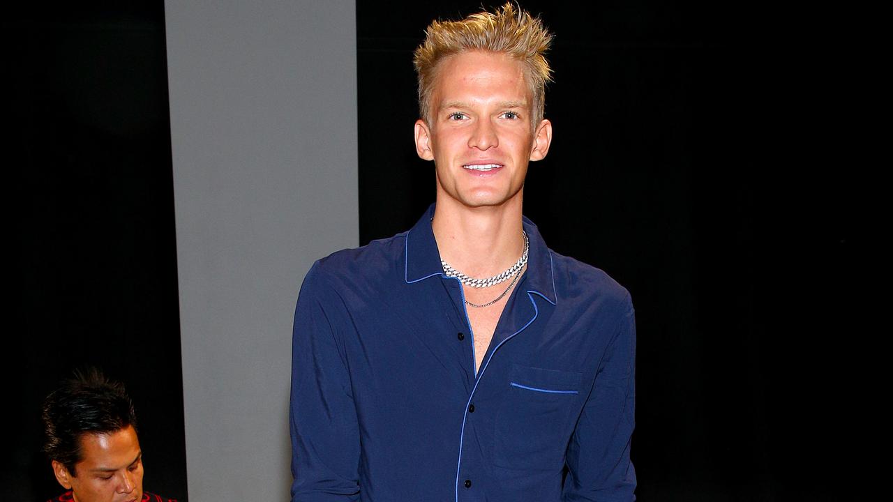 Fans are convinced that Australian singer Cody Simpson is behind the robot mask.