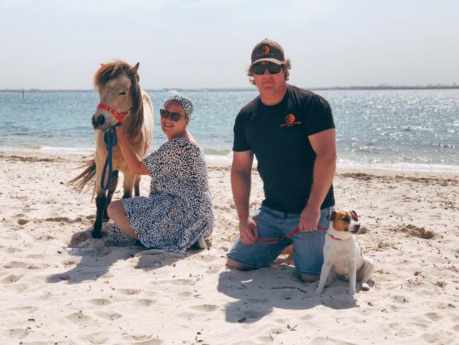 Rhiannon Clarke with pony Tayla and local dog behaviourist John Egliens at Silver Beach, Kurnell. Picture: Eliza Barr