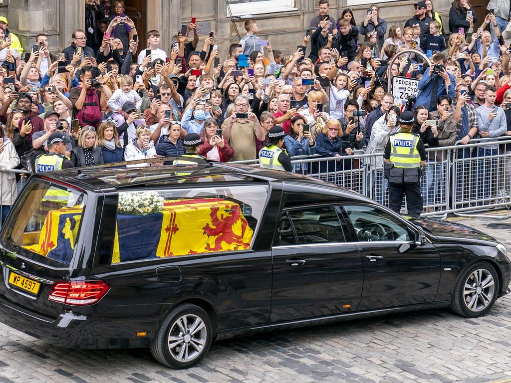 The hearse carrying the coffin of Queen Elizabeth II, without the ad, passes the City Chambers on the Royal Mile, Edinburgh. Picture: Getty Images.