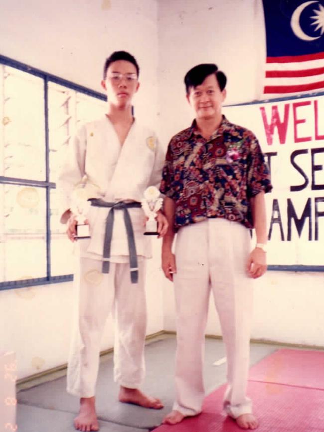 Yen-Yung Yap aged 16 with his judo master.