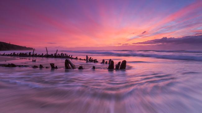 A magnificent sunrise over the shipwreck of Buster on Woolgoolga Beach captured by Ian Spagnolo.