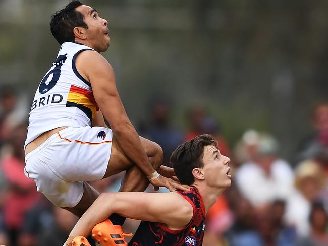 Eddie Betts and the Crows tried hard to keep Jake Lever down, but the Demon had a good day against his old side. Pic: AAP