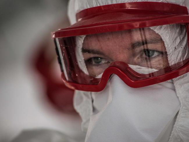 Australian Red Cross aid worker Amanda McClelland providing care at the Kenema Ebola treatment centre in Sierra Leone in 2014. Tommy Trenchard/Australian Red Cross