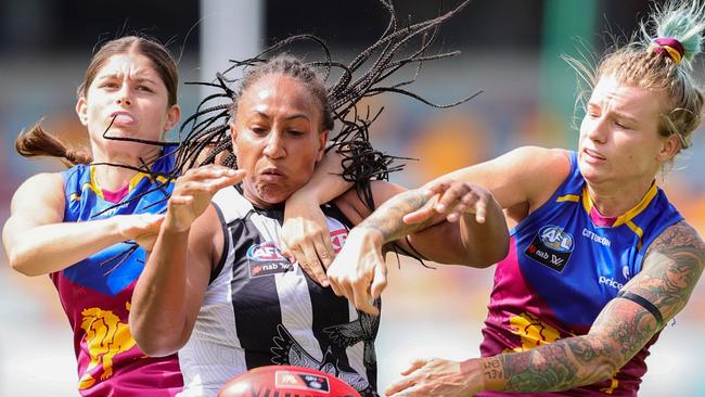 Sabrina Frederick fights for the footy between two Lions. Picture: Russell Freeman/AFL Photos via Getty Images