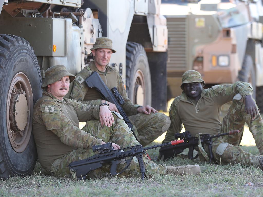 Australian soldiers Trooper Ashley Humphries, Trooper Darryl Sawley and trooper Kon Thon. Australian and American troops on the ground at Camp Rockhampton. Pic Peter Wallis