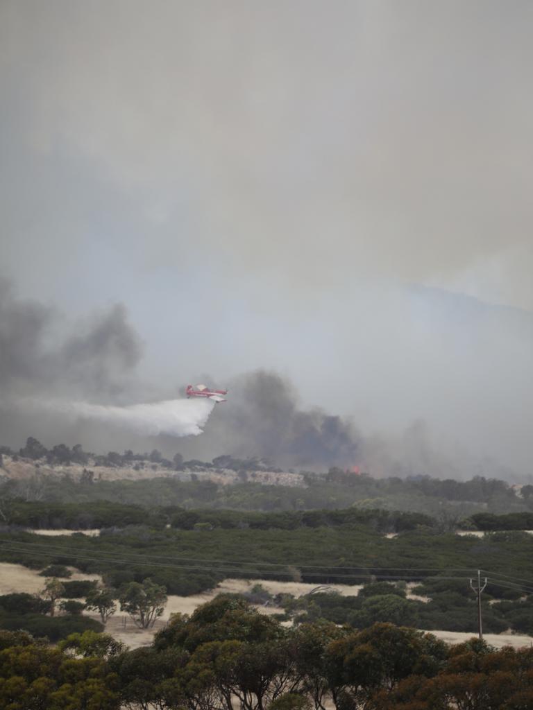 A plane drops fire retardant on the Duck Ponds fire as it heads towards Port Lincoln. Picture: Robert Lang