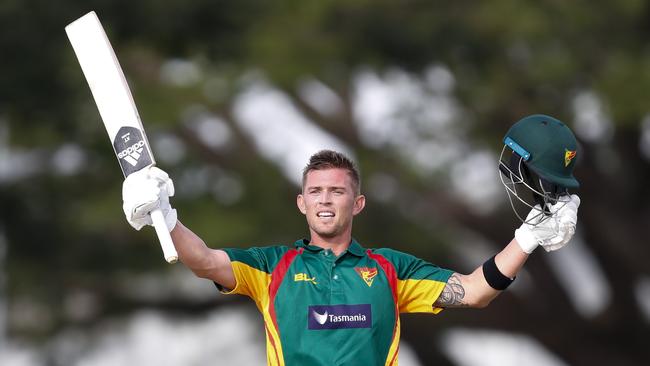 Ben McDermott of the Tigers celebrates scoring a century.