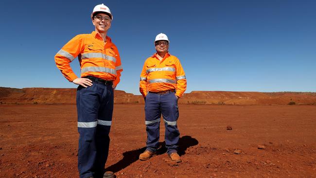 BHP chief executive Mike Henry (left) with the company’s Minerals Australia president, Edgar Basto, at the South Flank mine site in the Pilbara back in 2018. Picture: Colin Murty / The Australian