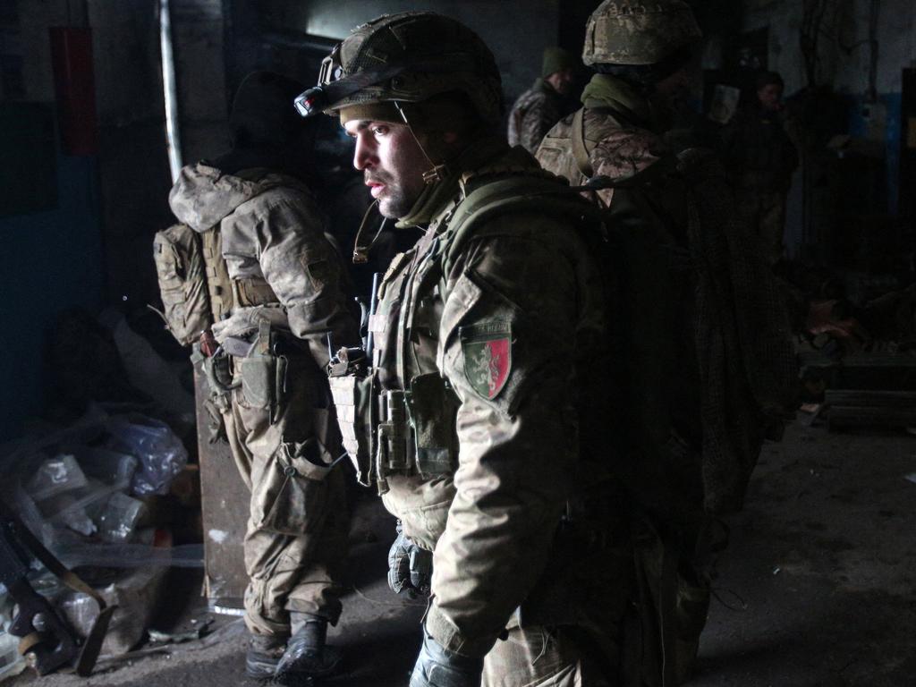 Servicemen of the Ukrainian Military Forces wait out the shelling in a shelter on a position in the Lugansk region. Picture: Anatolii Stepanov / AFP