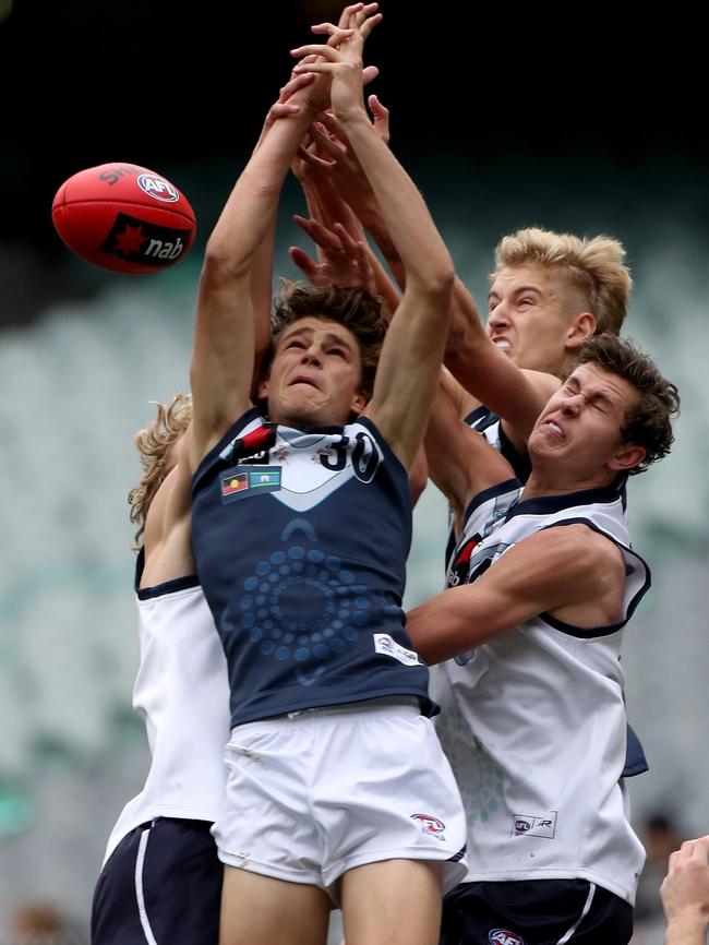 Harry Jones backs into the pack against Vic Country.