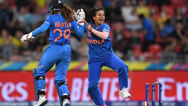 Poonam Yadav of India celebrates with wicketkeeper Taniya Bhatia after bowling Ellyse Perry of Australia for a duck. Picture: AAP