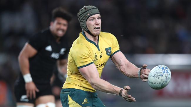 AUCKLAND, NEW ZEALAND — AUGUST 25: David Pocock of the Australian Wallabies offloads during The Rugby Championship game between the New Zealand All Blacks and the Australia Wallabies at Eden Park on August 25, 2018 in Auckland, New Zealand. (Photo by Phil Walter/Getty Images)