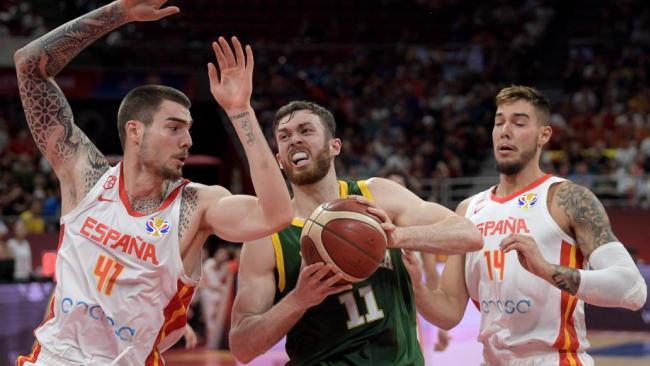 Nick Kay tries to breach the Spanish defence. Picture: AFP