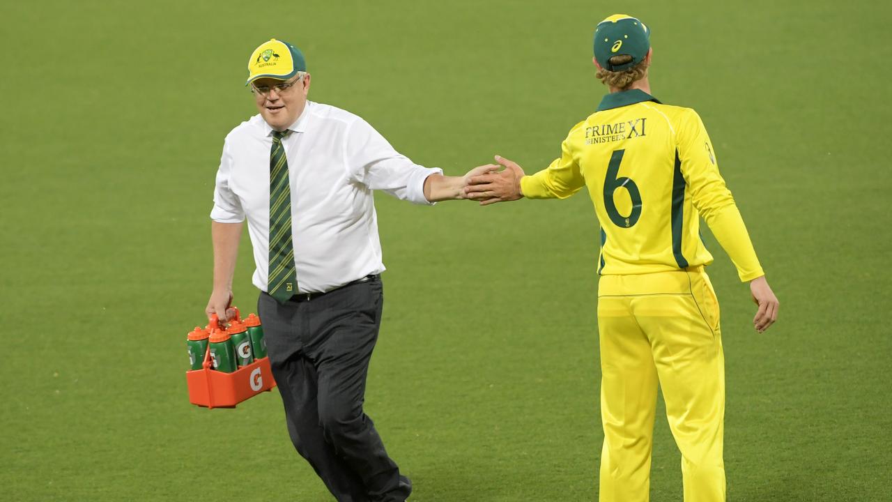 Prime Minister Scott Morrison runs water during the tour match between Prime Ministers XI and Sri Lanka at Manuka Oval on October 24, 2019 in Canberra, Australia. (Photo by Tracey Nearmy/Getty Images)