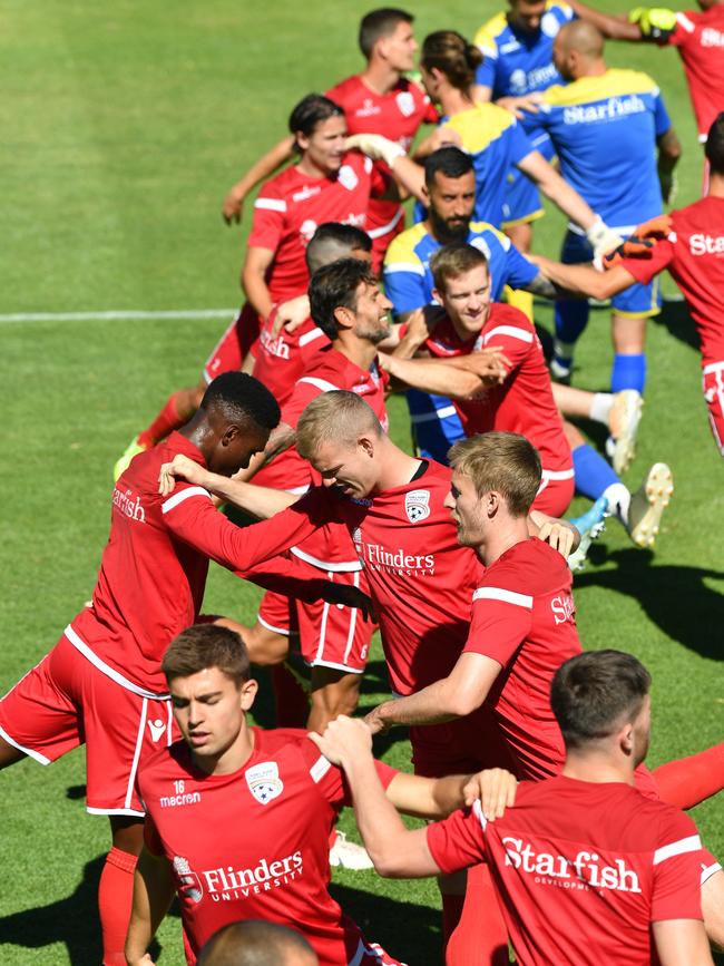 Reds players warm up for training at Marden. Picture: AAP Image/David Mariuz