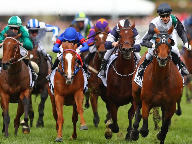 Jockey Cory Parish (right) and Boom Time clinch the 140th running of the Caulfield Cup. Picture: Getty Images