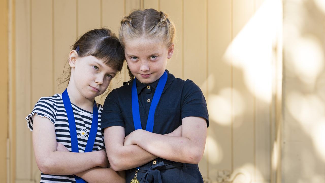 Fairholme students Cassie Webb (left) and Daisy McCormick won their Yr3 Poem in Pairs category with a poem about an annoying baby brother. Picture: Kevin Farmer