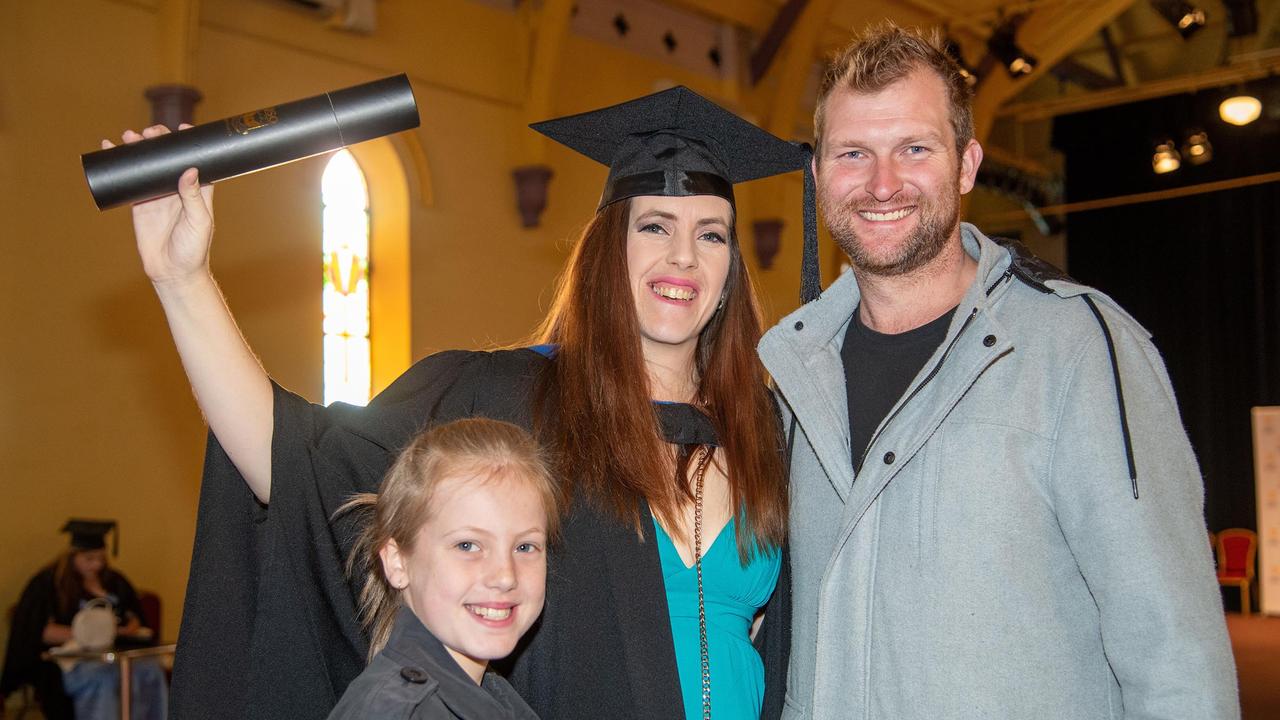 Celebrating her Bachelor of Nursing graduation, Sarah Breckenridge with her daughter Milla Breckenridge and partner Levi Kilbride. UniSQ graduation ceremony at Empire Theatre, Tuesday June 27, 2023.