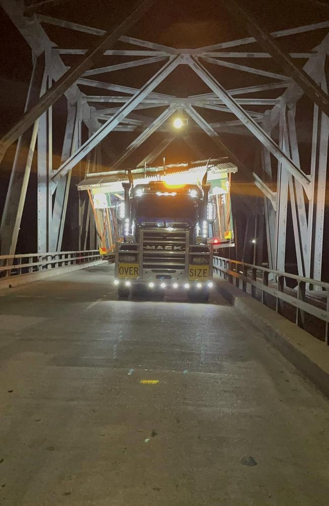 Jo Veneman's truck creeps across the Burdekin bridge, carefully keeping in the middle of the bridge with one road lane to the truck’s right and a railway line on the left.