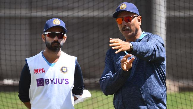 India’s brains trust in Melbourne. Captain Ajinkya Rahane, left, chats with coach Ravi Shastri Picture: AFP