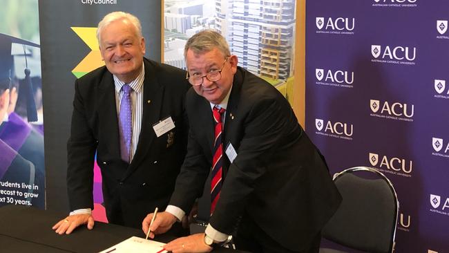 Blacktown Mayor Tony Bleasdale and ACU vice-chancellor Professor Greg Craven officially sign off on the blueprint for the new Blacktown campus. Picture: Supplied