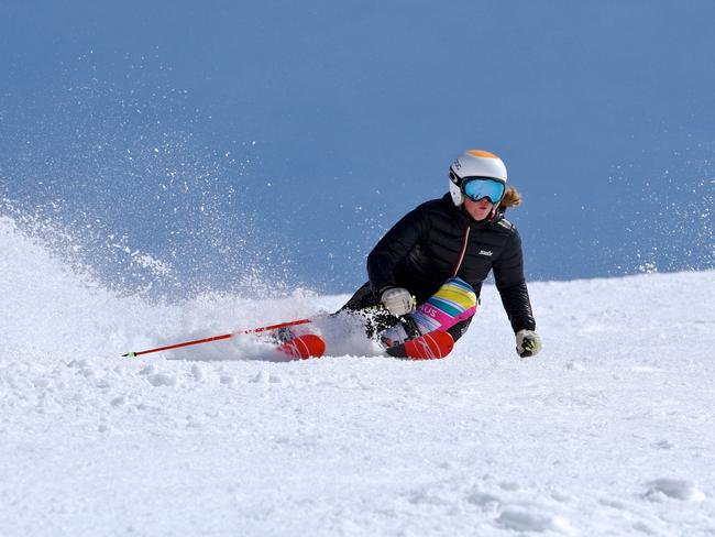 Falls Creek enters the School Holidays period with an enticing 174cm snow base. Mild temperatures are giving away to snowfalls later in the weekend as a cold front sweeps the state. The resort has extended the snow season to October 8th with the epic snowfalls this snow season. Local Alpine Racer Lily Tomkinson 20, makes a slashing ski turn at Falls Creek today.