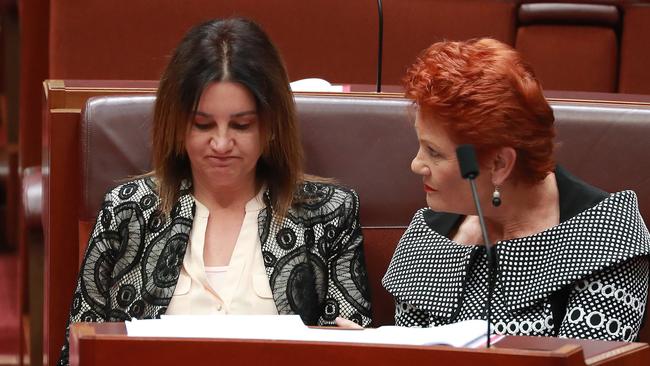 Senator Jacqui Lambie with Pauline Hanson before the vote on the Ensuring Integrity Bill in the Senate chamber on Thursday. Picture: Gary Ramage