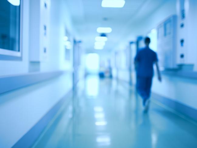 Hospital corridor and doctor as a blurred defocused background