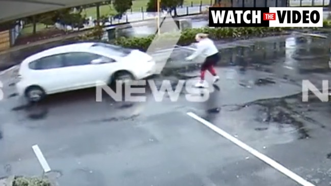 Terrifying moment man steals car with baby in back seat (7NEWS)