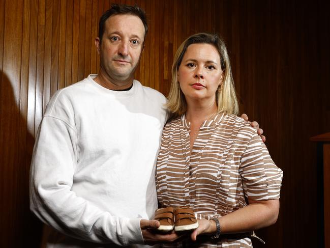 Elouise and Danny Massa hold the shoes of their two-year-old son who died in tragic circumstances after presenting at Northern Beaches Hospital’s emergency department. Picture: Jonathan Ng