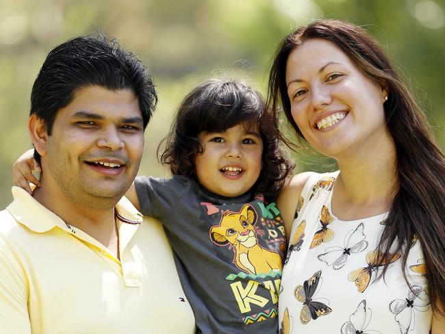 “Overall Liberal is doing a good job, we have been here almost 8 years and … we have everything we need here” - Kushagra Biharis, 38, a health worker from Penrith with his wife Alevtina Fokina and their son Jackson. Picture: Tim Hunter