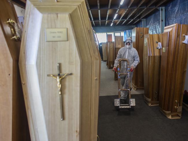 As the coronavirus ravages France, coffin makers and the rest of the funeral industry are working hard to keep up with a spike in demand. Picture: AP