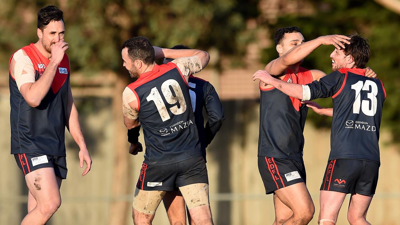 Essendon District: Tullamarine players celebrate a goal by Sam Laffan. Picture: Steve Tanner