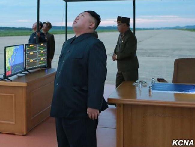 New undated photos released by North Korea show Kim Jong-un during the recent Hwasong-12 IRBM launch. Picture: KCNA